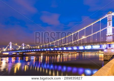 Krymsky Bridge Or Crimean Bridge  Across The Moskva River In Moscow In The Rays Of Setting Sun In Th