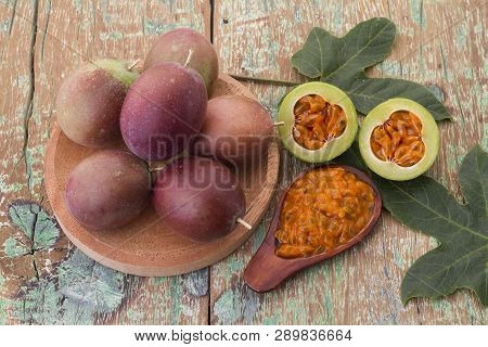 Fruits Of Gulupa On Vine Wood Table, Passiflora Pinnatistipula