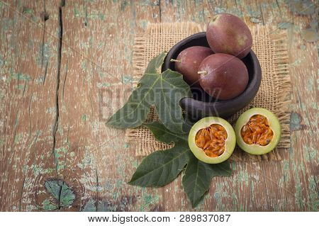 Fruits Of Gulupa On Vine Wood Table, Passiflora Pinnatistipula
