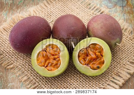Fruits Of Gulupa On Vine Wood Table, Passiflora Pinnatistipula