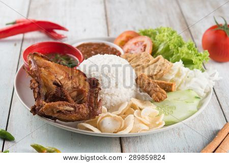Nasi lemak kukus with fried chicken, popular traditional Malaysian local food.