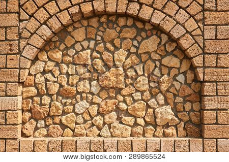 Sandstone Brick Wall Texture Background With Hole Between Briks