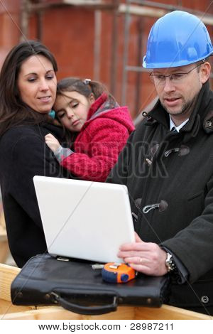 Architect on location with a young family