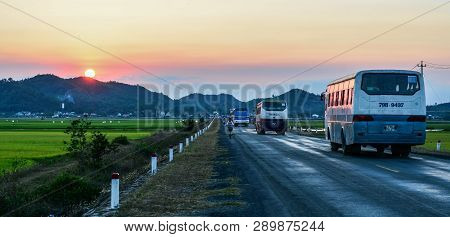 Cars Run On Highway At Sunset