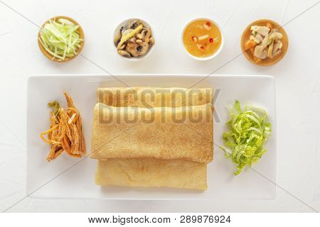 Traditional Chinese Tortillas Filled With Bings In A Plate On A White Background, Hot Salads, Dam Sa