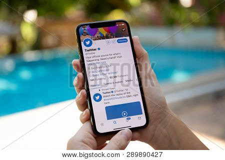 Koh Samui, Thailand - March 21, 2018: Woman Hand Holding Iphone X With Social Networking Service Twi