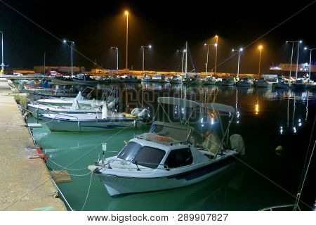 Night Pier With Lights And Small Boats