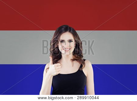 Love Netherlands! Happy Woman Smiling And Showing Thumb Up On Netherlandish Flag Background