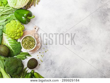 Assorted Green Toned Raw Organic Vegetables On White Background. Avocado, Cabbage, Broccoli, Caulifl