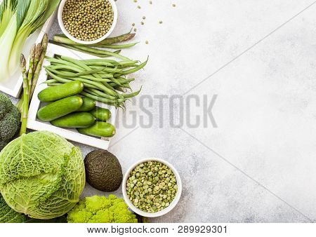 Assorted Green Toned Raw Organic Vegetables On White Background. Avocado, Cabbage, Broccoli, Caulifl