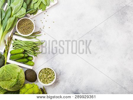 Assorted Green Toned Raw Organic Vegetables On White Background. Avocado, Cabbage, Broccoli, Caulifl