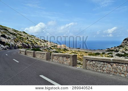 Amazing Landscape When Driving On An Open Coastal Road Winding Through To Lighthouse Cap Formentor