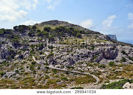 Open Coastal Road Winding Through To Lighthouse Cap Formentor