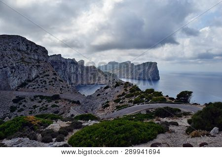 Amazing Landscape When Driving On An Open Coastal Road Winding Through To Lighthouse Cap Formentor