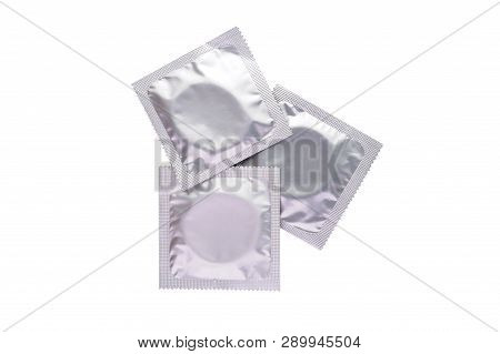 Condom On A White Background. Background Of Condoms. Condoms On A White Background.