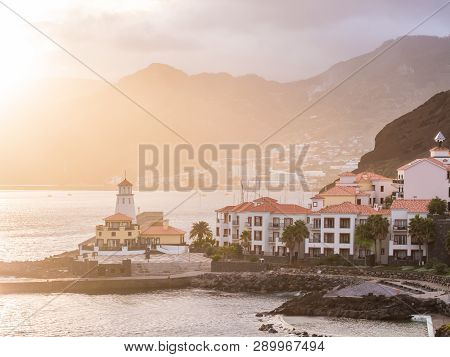 View Of Canical, A Town In The Madeira Island With A Lighthouse, Portugal, At Sunset.