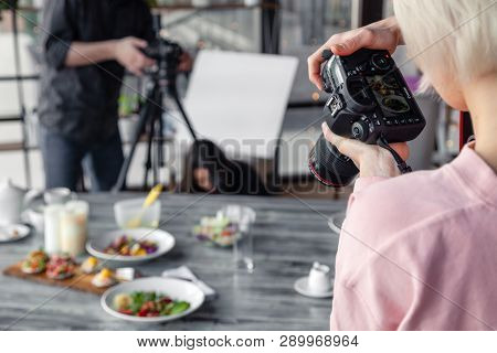 Russia Kemerovo 2019-03-10 Girl Photographer Taking Pictures On Professional Camera Canon 5D Mark Iv
