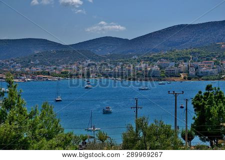 Beautiful View Of The Mountains, Trees, Blue Sea With Small Boats
