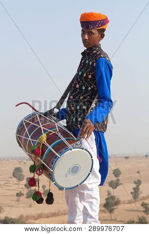 Indian Drummer In Traditional Clothes. Rajasthan State, India