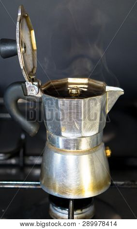 Moka On The Stove.italian Traditional Old Coffee Maker With Hot Espresso  Inside, Open A Coffee Pot,