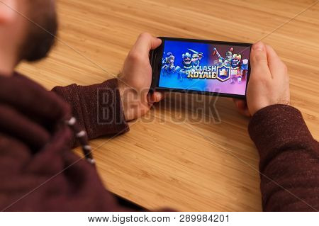 Prague, Czech Republic - March 16, 2019: Man Holding A Smartphone And Playng The Clash Royale Mobile