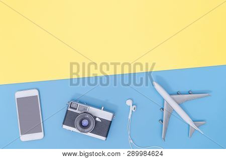 Hi Tech Travel Gadget And Accessories On Blue Yellow Copy Space Flat Lay Top View