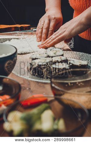The Process Of Preparing Sushi From Rice And Additional Ingredients At Home