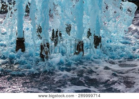 Foreground In Horizontal View Of A Source Expelling Blue Water