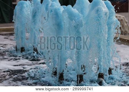 Foreground In Horizontal View Of A Source Expelling Blue Water