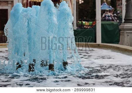 Foreground In Horizontal View Of A Source Expelling Blue Water