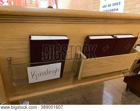 Springfield, Il/usa-10/3/20: A Hymnal And Bible Behind A Pew For The Parisioner To Use  For The Sund