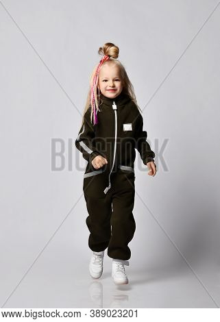 Playful Frolic Blonde Kid Baby Girl With Stylish Hairstyle And Colorful Braids In Brown Comfortable 