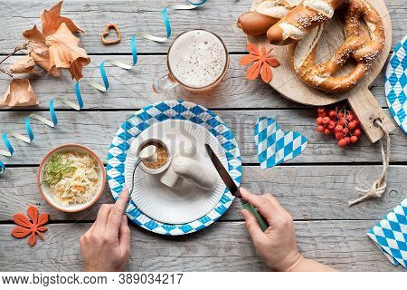 Celebrating Oktoberfest Alone. Traditional Food And Beer, Top View On Aged Wooden Table,