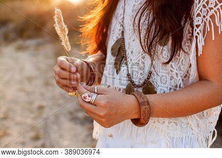 Beautiful Boho Woman In A Sunny Field At Sunsrt.