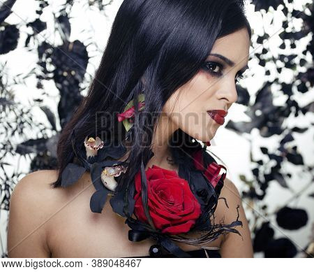 Pretty Brunette Woman With Rose Jewelry, Black And Red, Bright Make Up Kike A Vampire Closeup Red Li