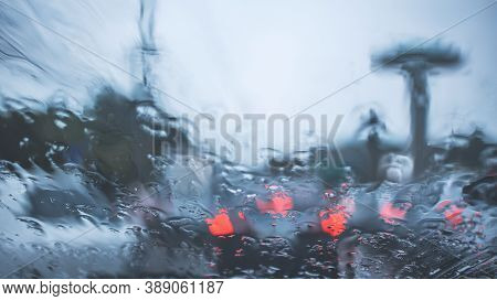 Driving Car On Road In The Rain With Raindrop Over The Wind Shield, Traffic Jam In Rainy Season