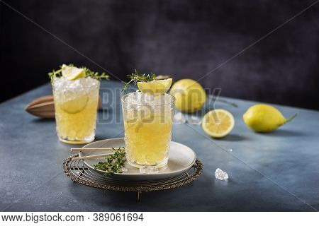 Cocktail With Lemon, Timo And Crushed Ice