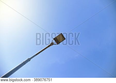 Led Street Light In The Center Of The Frame, Crop. Lantern On A Background Of Blue Light Sky