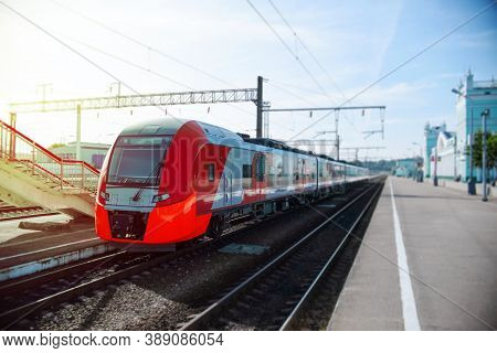 Modern High-speed Train On The Platform. Passenger Red Train At The Station Waiting.