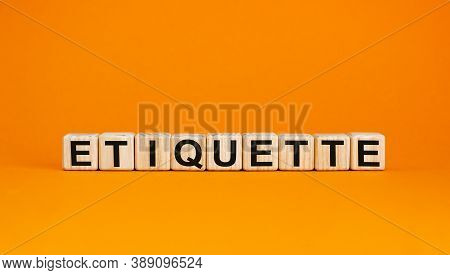 Concept Word 'etiquette' On Cubes On A Beautiful Orange Background. Business Concept. Copy Space.