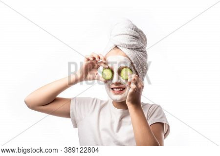 10 Years Old Preteen Chilling Making Clay Facial Mask Nd Cucumber Slices On Eyes. Teenage Girl Doing