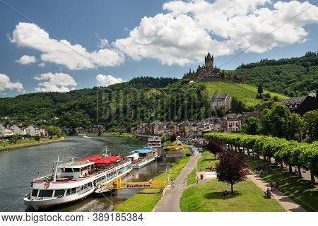 Cochem, Germany - June 22, 2020: Panoramic Image Of Cochem With Old Castle And River Cruise Ships On