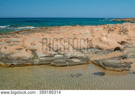 Sea Coast And Beach With Rocks, Rocky Coastline, Blue Sea, Good Sunny Day. Summer Trip. Beautiful Gr
