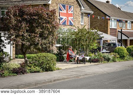 Ackworth, Uk - May 08, 2020: A Family Come Out From Houses To The Street To Celebrate 75th Anniversa