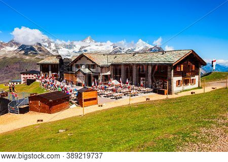 Zermatt, Switzerland - July 16, 2019: Cable Car Station And Street Cafe Located Near Zermatt Town In