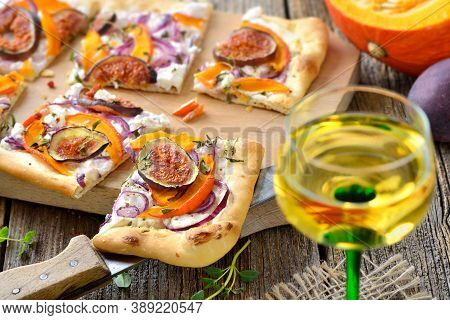 Tarte Flambee From Alsace With Goat's Cream Cheese, Onions, Slices Of Pumpkins And Figs, Served With