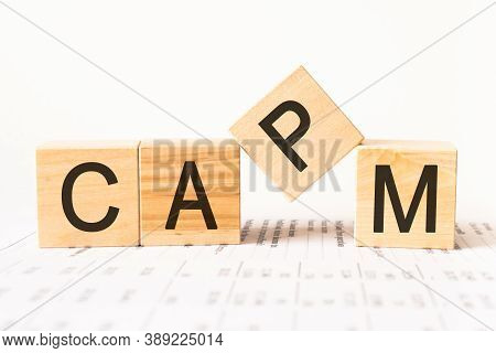 Word Capm. Wooden Small Cubes With Letters Isolated On White Background With Copy Space Available.bu
