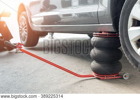 Car Wheel Repair Shop Outdoor Ground . Seasonal Winter Tyre Change At Workshop. Vehicle Tire Repair,