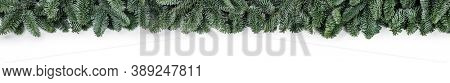 Natural noble fir Christmas tree border frame isolated on white , copy space for text
