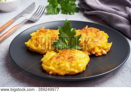 Fried Cakes Of Grated Potatoes On The Plate With Sauce. Traditional Pancakes Boxty Raggmunk.